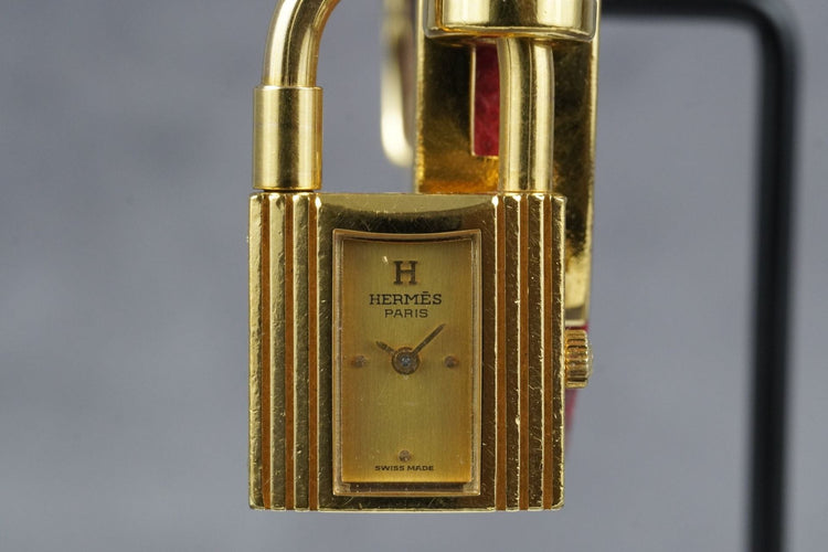 Hermès Kelly - Montre plaqué or bracelet cuir rouge 58 Facettes TOT-11286