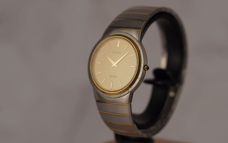 Seiko Laurel - Montre unisexe acier et or jaune 58 Facettes TOT-10679