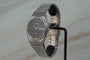 Montre Rado Quartz Day Date - Montre unisexe en acier 58 Facettes TOT-11208