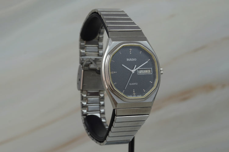 Montre Rado Quartz Day Date - Montre unisexe en acier 58 Facettes TOT-11208