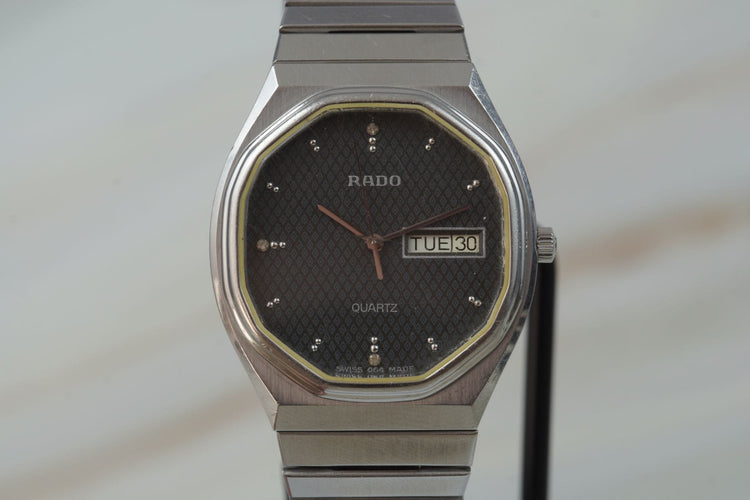 Montre Rado Quartz Day Date - Montre unisexe en acier 58 Facettes TOT-11208