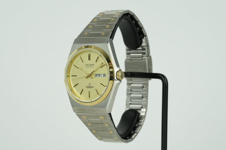 Orient Quartz - Montre unisexe en acier 58 Facettes TOT-01596