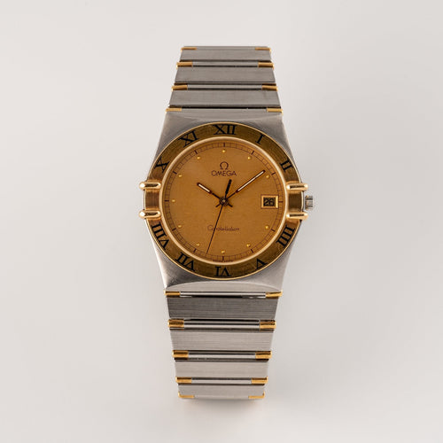 Omega Constellation - Montre quartz en or et acier 58 Facettes TOT-02214