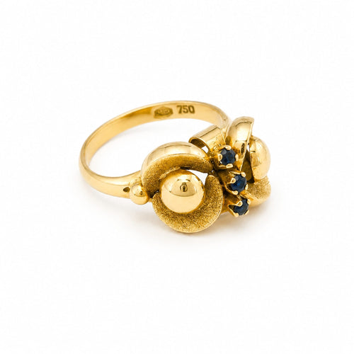 https://18carats.fr/wp-content/uploads/2026/06/37712-37715-Bague-art-nouveau-en-or-jaune-sertie-de-saphirs.jpg