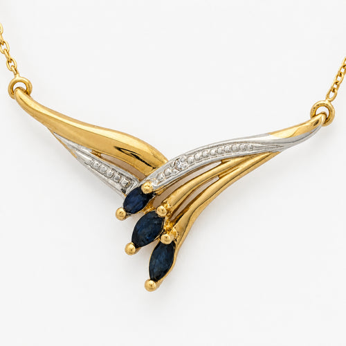 https://18carats.fr/wp-content/uploads/2026/06/37362-37850-Collier-stylise-en-or-bicolore-serti-de-saphirs-navette.jpg