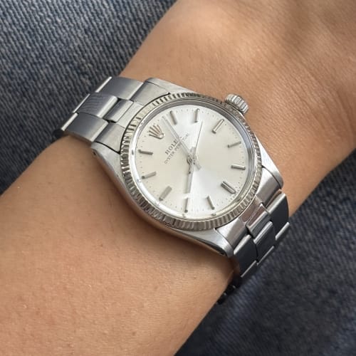 Montre Rolex Oyster Perpetual - Montre en acier, lunette cannelée en or blanc 58 Facettes 36869