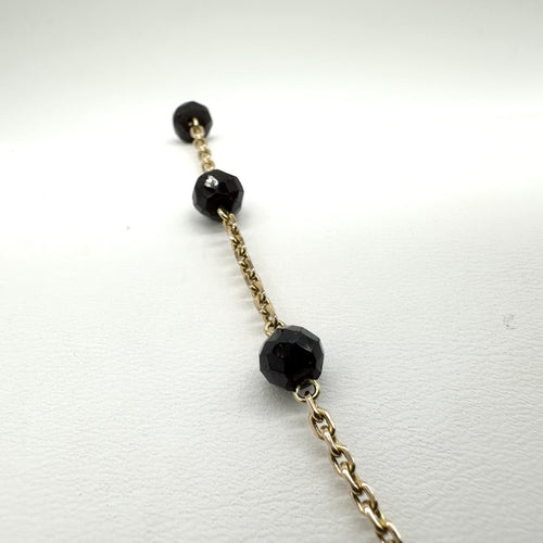 Collier Collier en or jaune 750 et grenats 58 Facettes Z15B51717