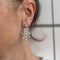 Boucles d'oreilles Boucles d’oreilles pendantes chandelier en or blanc 18 ct et diamants 58 Facettes 33777O