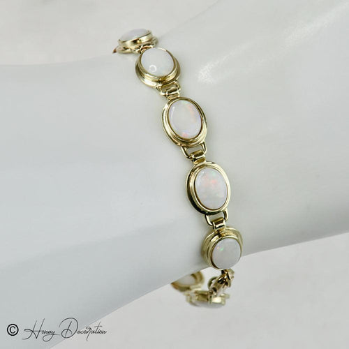 Bracelet Bracelet vintage en or jaune 14 carats et opales 58 Facettes 2556