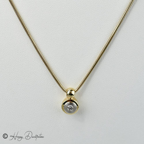 Collier Collier chaîne serpent en or 14 carats avec pendentif bicolore et diamant 58 Facettes 2036