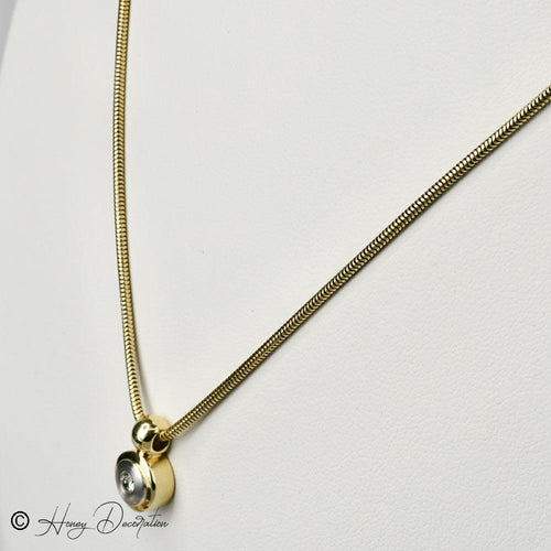 Collier Collier chaîne serpent en or 14 carats avec pendentif bicolore et diamant 58 Facettes 2036