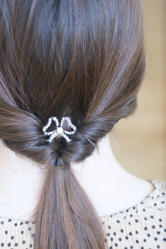 Peigne à cheveux nœud en corne, métal argenté et pierres du Rhin 58 Facettes