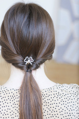 Peigne à cheveux nœud en corne, métal argenté et pierres du Rhin 58 Facettes