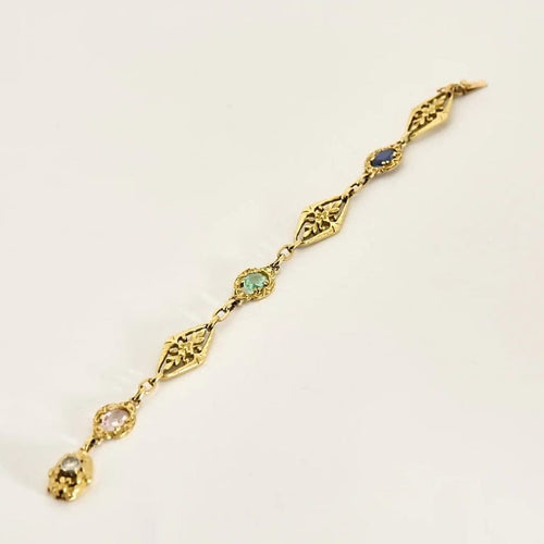 Bracelet Bracelet en or jaune, saphir, topaze rose, émeraude et diamant 58 Facettes PER1612