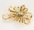Broche Splendide Broche noeud stylisée en or jaune et diamants 58 Facettes ROD4591