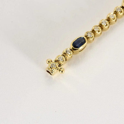 Bracelet Bracelet articulé en or jaune 18k et diamants, saphirs 58 Facettes DADB-16