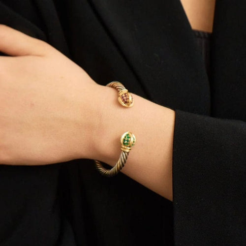 Bracelet Bracelet torque en or jaune 18k et rubis, émeraudes 58 Facettes ALGU15