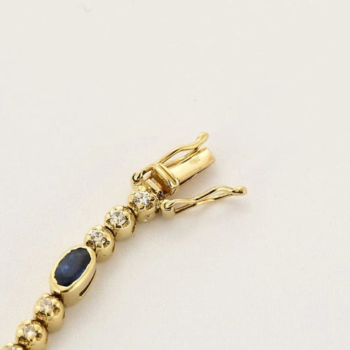 Bracelet Bracelet articulé en or jaune 18k et diamants, saphirs 58 Facettes DADB-16