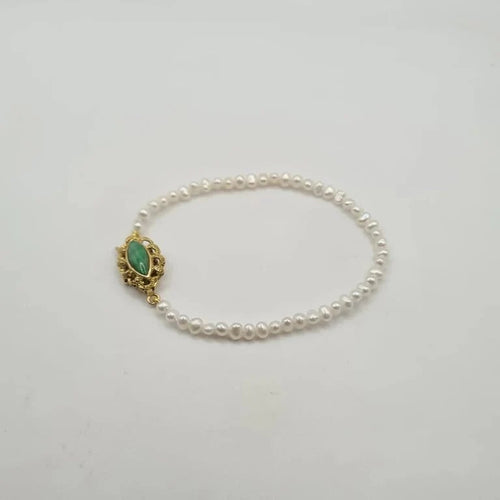 Bracelet Bracelet or jaune 14 carats serti de perles et pierre verte 58 Facettes