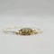 Bracelet Bracelet or jaune 14 carats serti de perles et pierre verte 58 Facettes