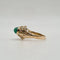 Bague 49 Bague or jaune sertie d'une pierre verte 58 Facettes