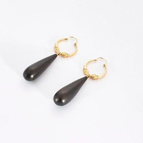 Boucles d'oreilles Boucles d’oreilles créoles têtes de béliers en or jaune 18k et ébène 58 Facettes AB59