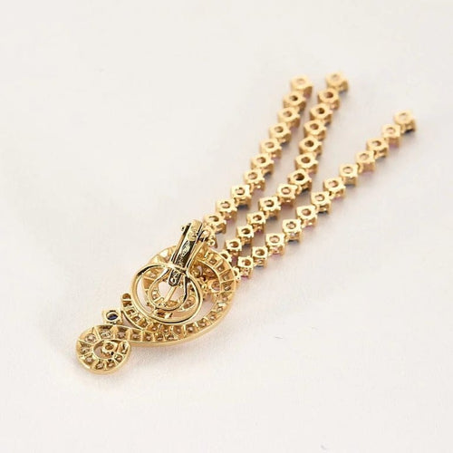 Boucles d'oreilles Boucles d'oreilles note de musique en or rose 18k et saphirs 58 Facettes N2984