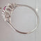 Bague 57 Bague or blanc, rubis fin au centre et entourage diamants Princesse 58 Facettes