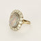 Bague 53.5 Importante bague marguerite en or blanc, opale et diamants 58 Facettes 58FC106