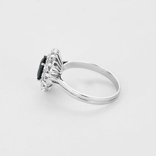 Bague 55 Bague marguerite - Bague en or gris 18k, saphir ovale et diamants 58 Facettes BA514