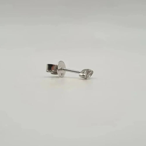 Boucles d'oreilles Boucle d’oreille puce or blanc 18 carat sertie d’un diamant navette 58 Facettes