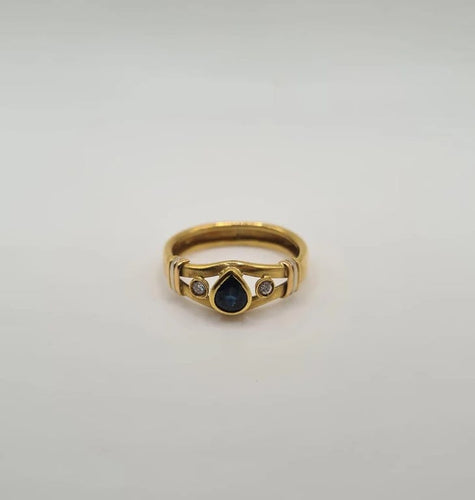 Bague 56 Bague or jaune sertie de diamants et d’un saphir 58 Facettes