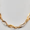 Collier Collier à maillons losangiques en or jaune et or gris 18k 58 Facettes ALGU24