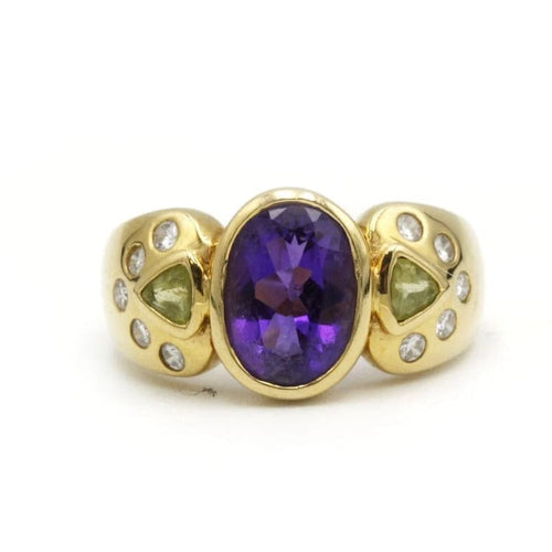 Bague 46 Bague en or jaune 750‰ sertie d’améthyste, péridots et diamants 58 Facettes 250290R
