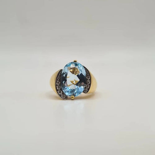 Bague 53 Bague or jaune 18 carats sertie d’une topaze bleue et diamants 58 Facettes