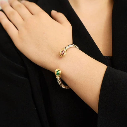 Bracelet Bracelet torque en or jaune 18k et rubis, émeraudes 58 Facettes ALGU15