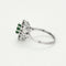 Bague 53 Bague marguerite or blanc, émeraude et diamants 58 Facettes EPI10662
