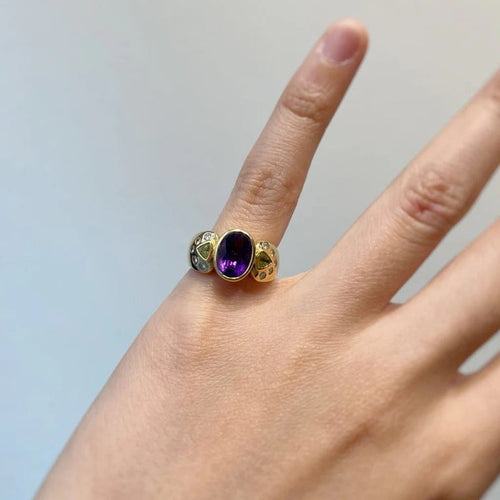Bague 46 Bague en or jaune 750‰ sertie d’améthyste, péridots et diamants 58 Facettes 250290R