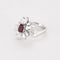 Bague 53.5 Bague mouvementée en or blanc 18k et rubis, diamants 58 Facettes BA661