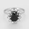 Bague 52.5 Bague marguerite en or blanc, saphir et diamants 58 Facettes DIE1840