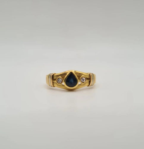 Bague 56 Bague or jaune sertie de diamants et d’un saphir 58 Facettes