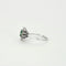 Bague 57 Bague marguerite en or gris, émeraude et diamants 58 Facettes GU88