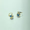 Boucles d'oreilles Boucles d’oreilles pendantes motif œil bleu en or jaune 14 ct 58 Facettes 250366