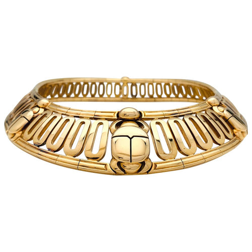Collier Collier torque Cartier, "Scarabée", en or jaune. 58 Facettes 29929