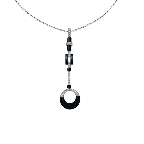 Collier Collier Cartier "Attraction" en or blanc, diamants, onyx et nacre. 58 Facettes 30008