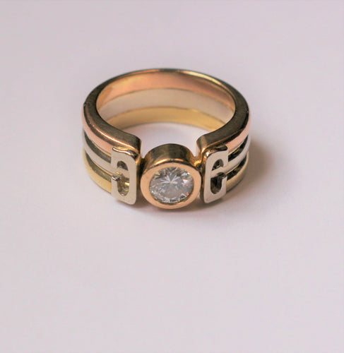 Bague Bague trois Ors sertie d'un diamant 58 Facettes 355
