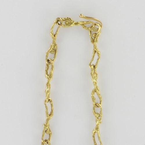 Collier Collier or personnages entrelacés 58 Facettes 12-037