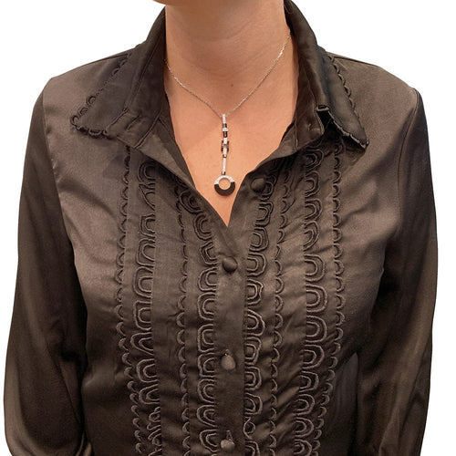 Collier Collier Cartier "Attraction" en or blanc, diamants, onyx et nacre. 58 Facettes 30008
