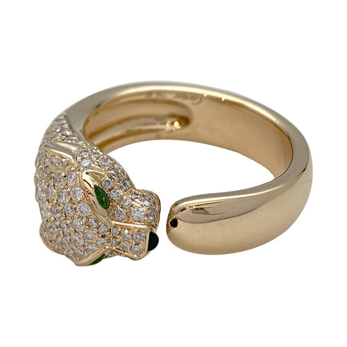 Bague 67 Bague Cartier modèle "Panthère" en or jaune, onyx, émeraudes et diamants. 58 Facettes 29715-1