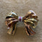Broche Broche noeud or jaune & rose rubis & diamants 58 Facettes CEY26